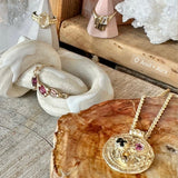 coral medallion pendant