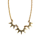 Gold diamond necklace with 3 star-shaped pendants on a white background